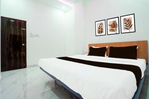 KhāpriにあるHotel O Hybridの部屋の中に大きなベッドがある寝室 +53枚の写真