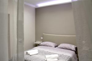 Postel nebo postele na pokoji v ubytování Le Mirage boutique II