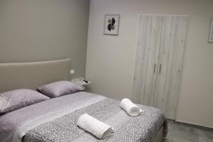 Postel nebo postele na pokoji v ubytování Le Mirage boutique II