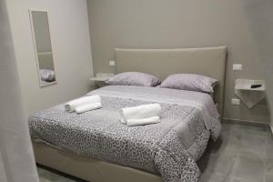 Postel nebo postele na pokoji v ubytování Le Mirage boutique II