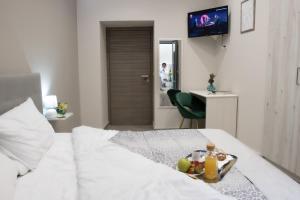 Postel nebo postele na pokoji v ubytování Le Mirage boutique II