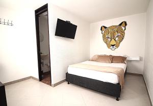 Voodi või voodid majutusasutuse DAM Hotel Pereira toas