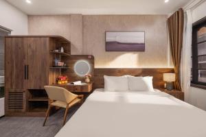 Ein Bett oder Betten in einem Zimmer der Unterkunft Kly Luxury Hotel
