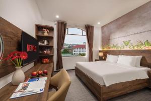 Ein Bett oder Betten in einem Zimmer der Unterkunft Kly Luxury Hotel