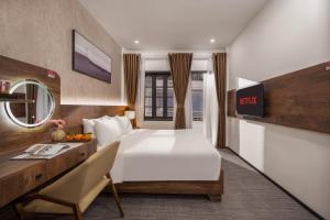 Ein Bett oder Betten in einem Zimmer der Unterkunft Kly Luxury Hotel