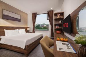 Ein Bett oder Betten in einem Zimmer der Unterkunft Kly Luxury Hotel