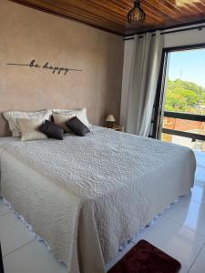 Postel nebo postele na pokoji v ubytování Apartamento aconchegante com vista para o mar + 35 fotografií