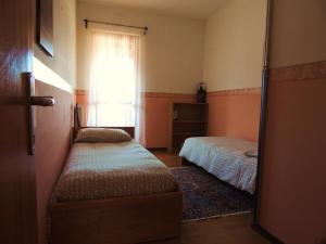 En eller flere senge i et værelse på La Collina D'Oro