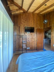 Giường trong phòng chung tại Cabaña Loto - Paipa +17 ảnh