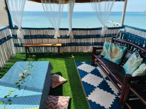 a balcony with a view of the ocean at HiGhLanDer SeAsuN in San Fernando