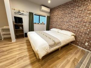 Voodi või voodid majutusasutuse 安楽居101 toas