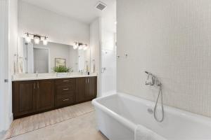 a bathroom with a white tub and a sink and a tub at Villa #02 at Bloomington Country Club condo in St. George +35 photos