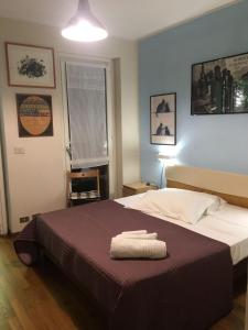 Posteľ alebo postele v izbe v ubytovaní Appartamentino autonomo zona Gran Madre di Dio