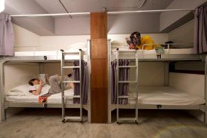 Postel nebo postele na pokoji v ubytování 拉開門輕旅 Le Passage Hostel