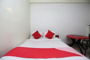 Postel nebo postele na pokoji v ubytování Super Hotel O Nandi Inn + 37 fotografií