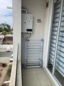 a room with a heater on the side of a building at Asturias La Serena in La Serena