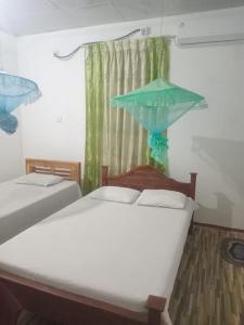 Postel nebo postele na pokoji v ubytování Green Villa