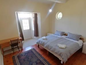 En eller flere senge i et værelse på Restful Tree House in Little Mowbray