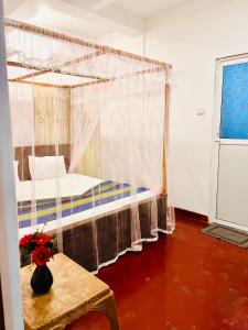 Postel nebo postele na pokoji v ubytování Wasana Ocean View Villa Mirissa