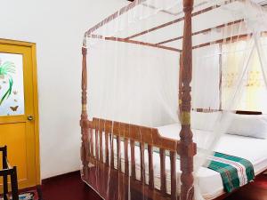 Postel nebo postele na pokoji v ubytování Wasana Ocean View Villa Mirissa