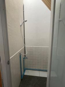 a shower in a bathroom with a glass door at CozyHouse Korat in Sathani Phu Khao Lat
