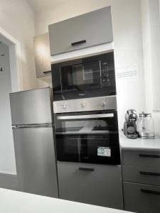 Kuchyň nebo kuchyňský kout v ubytování Gaelle Voghera apartment