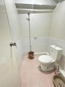 a bathroom with a toilet and a shower at Home stay near at Vluna Medical Center Kalayaan Avenue, Philippine Heart Center, East Avenue Medical Hospital, Quezon City in Manila