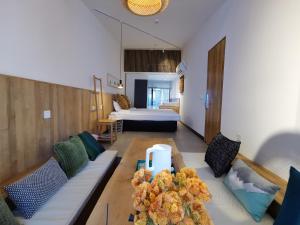 Rúm í herbergi á Suzhou Xugusu B&B-Tangyinci Taohuawu Branch