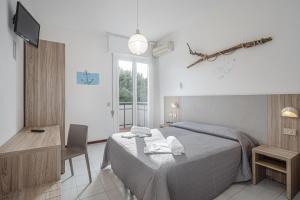 TV a/nebo společenská místnost v ubytování Hotel Astrid + 37 fotografií