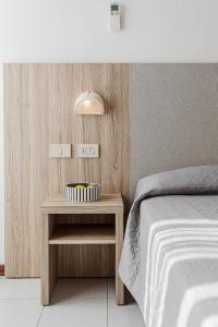 Postel nebo postele na pokoji v ubytování Hotel Astrid