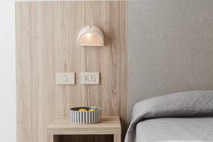 Postel nebo postele na pokoji v ubytování Hotel Astrid