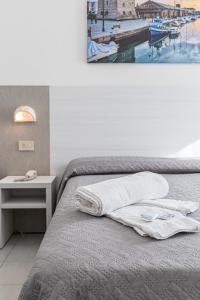 Postel nebo postele na pokoji v ubytování Hotel Astrid