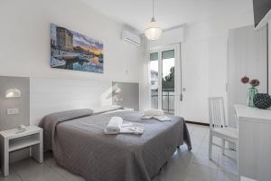 Postel nebo postele na pokoji v ubytování Hotel Astrid