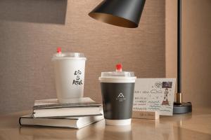 two coffee cups sitting on top of a table at Atour Hotel Xi'an Gaoxin North Zhangba Road in Xi'an
