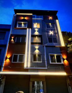 a building with lights on the side of it at Hotel Green View in Ujjain
