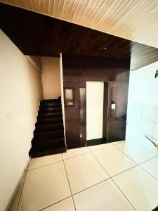 a hallway with a staircase in a building at Hotel Green View in Ujjain