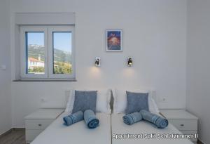 Posteľ alebo postele v izbe v ubytovaní Ferienhaus Elias Nikola