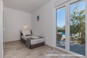 Posteľ alebo postele v izbe v ubytovaní Ferienhaus Elias Nikola