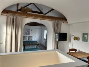 a room with a bed and a large mirror at Loft in Bungay in Bungay