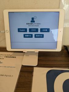 a computer monitor sitting on top of a desk at 日本の一軒家貸切 Goodfellas Inn Osaka 鶴橋1 in Osaka