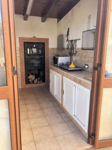 A kitchen or kitchenette at Charming apartment Menfi sea view