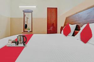 Postel nebo postele na pokoji v ubytování Hotel O City Lodge