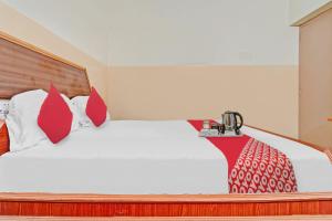 Postel nebo postele na pokoji v ubytování Hotel O City Lodge