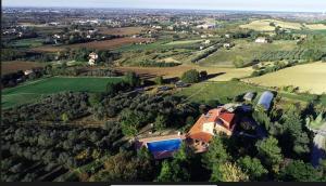 an aerial view of a house in a field at Villa Dell' Artista - Villa Anna in Santarcangelo di Romagna