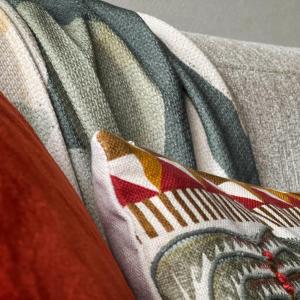 a close up of a blanket with patterns on it at Duinhelm Vakantiestudio Mariakerke - A cosy place by the sea in Ostend +41 photos