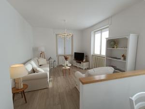 a living room with a couch and a table at Casa vacanze Orobie in Villa di Tirano