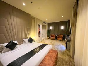 a bedroom with a large bed and a living room at Eastern Al Montazah Hotel in Alexandria +100 photos