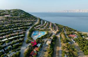 an aerial view of a resort near the water at Mobile Home Livanda in Klenovica