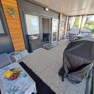 a room with a table with fruit on it at Mobile Home Livanda in Klenovica