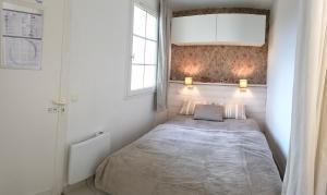 Ένα ή περισσότερα κρεβάτια σε δωμάτιο στο Charmant logement Port Bourgenay +18 φωτογραφίες